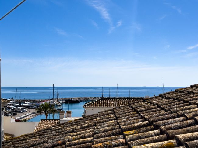 Duplex Penthouse in Puerto de la Duquesa with Partial Sea and Marina Views.