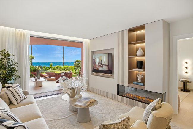 Impeccably renovated, south facing beach front, garden apartment located in the exclusive Menara Beach community on the sought-after New Golden Mile