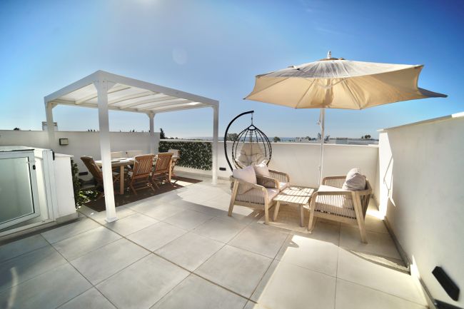 This townhouse in Los Miradores del Sol, Bel-Air Estepona