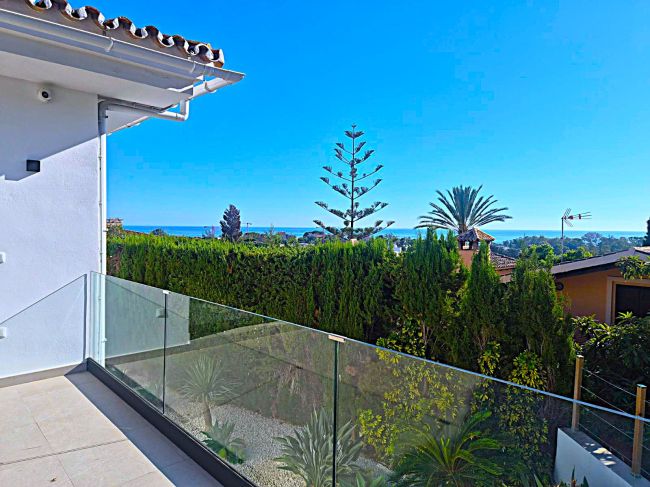 A superb modern villa walk to the beach with panoramic views.