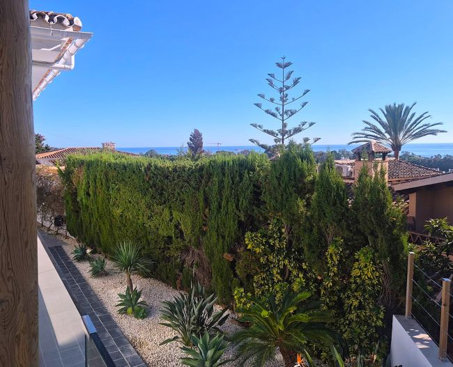 A superb modern villa walk to the beach with panoramic views.