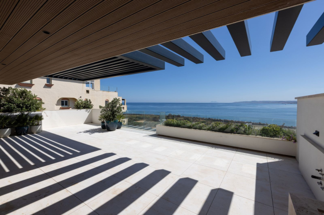 Discover the epitome of coastal luxury with this stunning apartment in a prestigious front-line beach development in Estepona