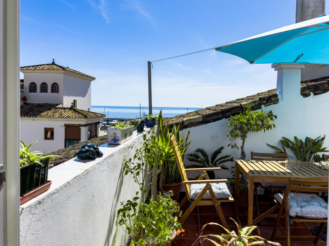 Duplex Penthouse in Puerto de la Duquesa with Partial Sea and Marina Views.