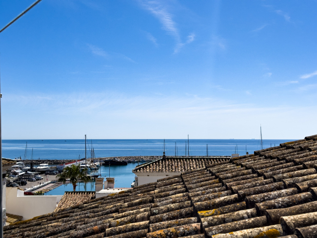 Duplex Penthouse in Puerto de la Duquesa with Partial Sea and Marina Views.